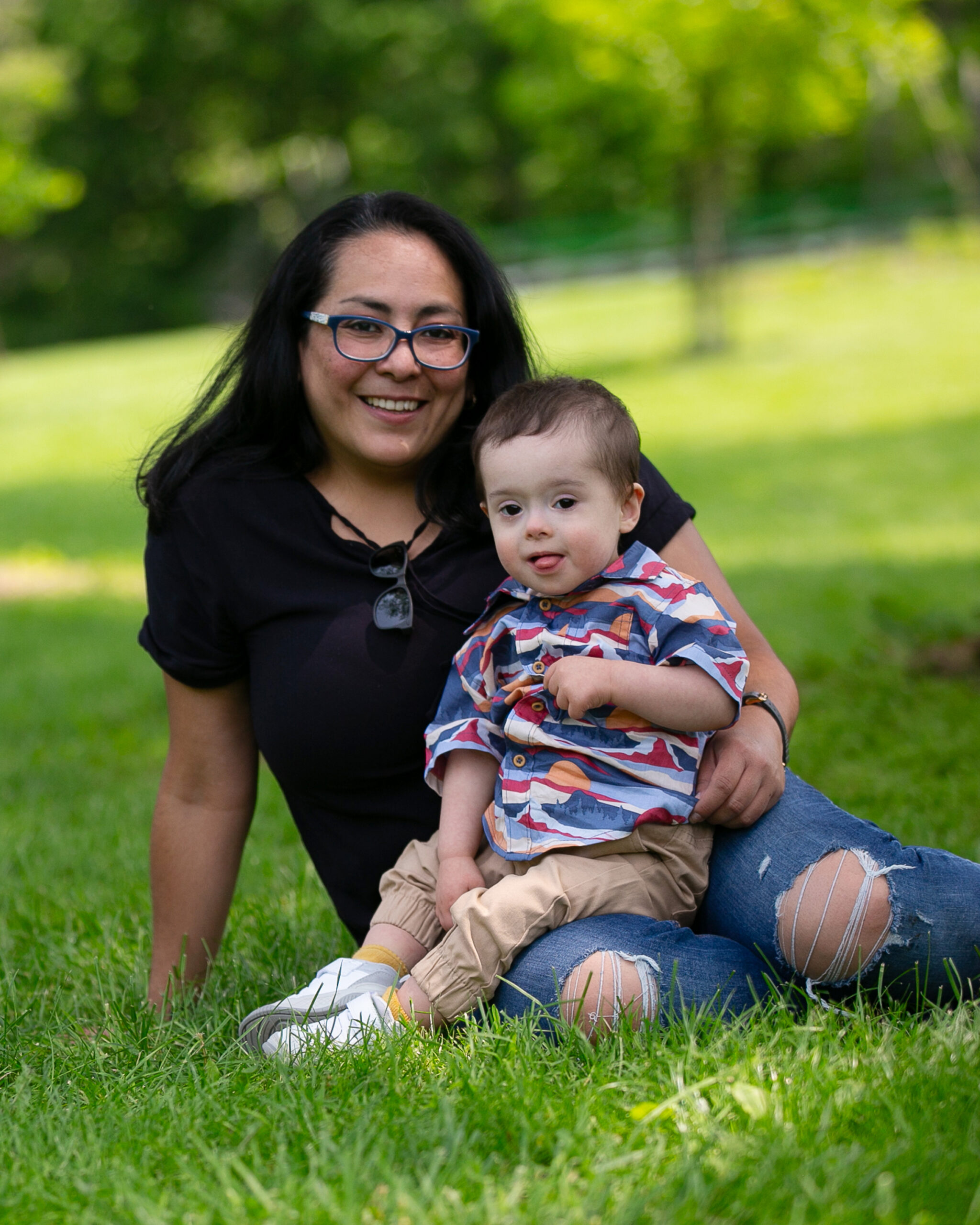 Latino mom with her young son with Down syndrome.